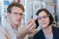 Researchers at the Technical University of Munich (TUM) examine an artificial heart valve produced with the additive manufacturing technology melt electrowriting.